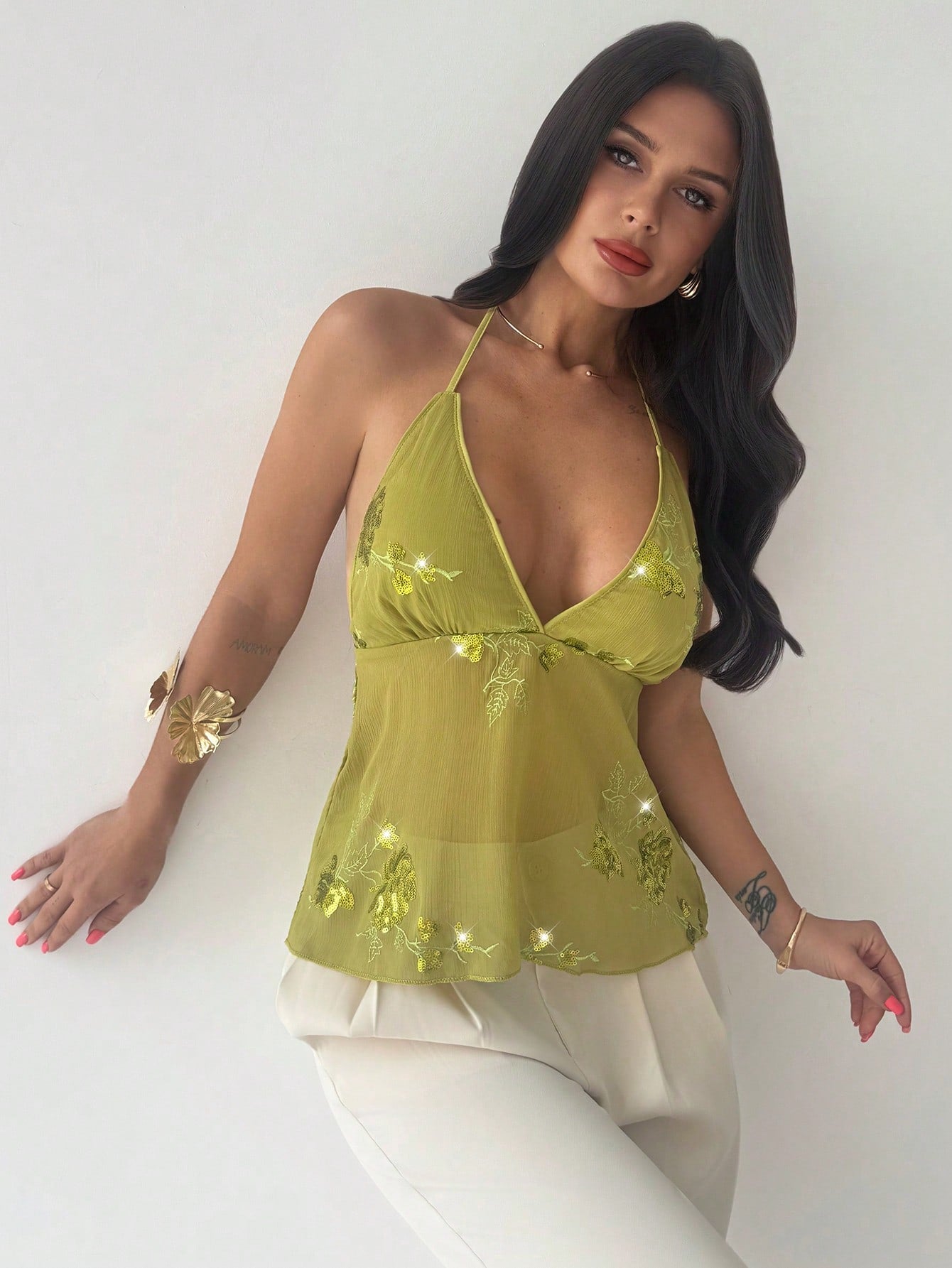 Firerie women's green crop cami top with beaded floral embroidery, spaghetti straps, lace-up back, and flared hem