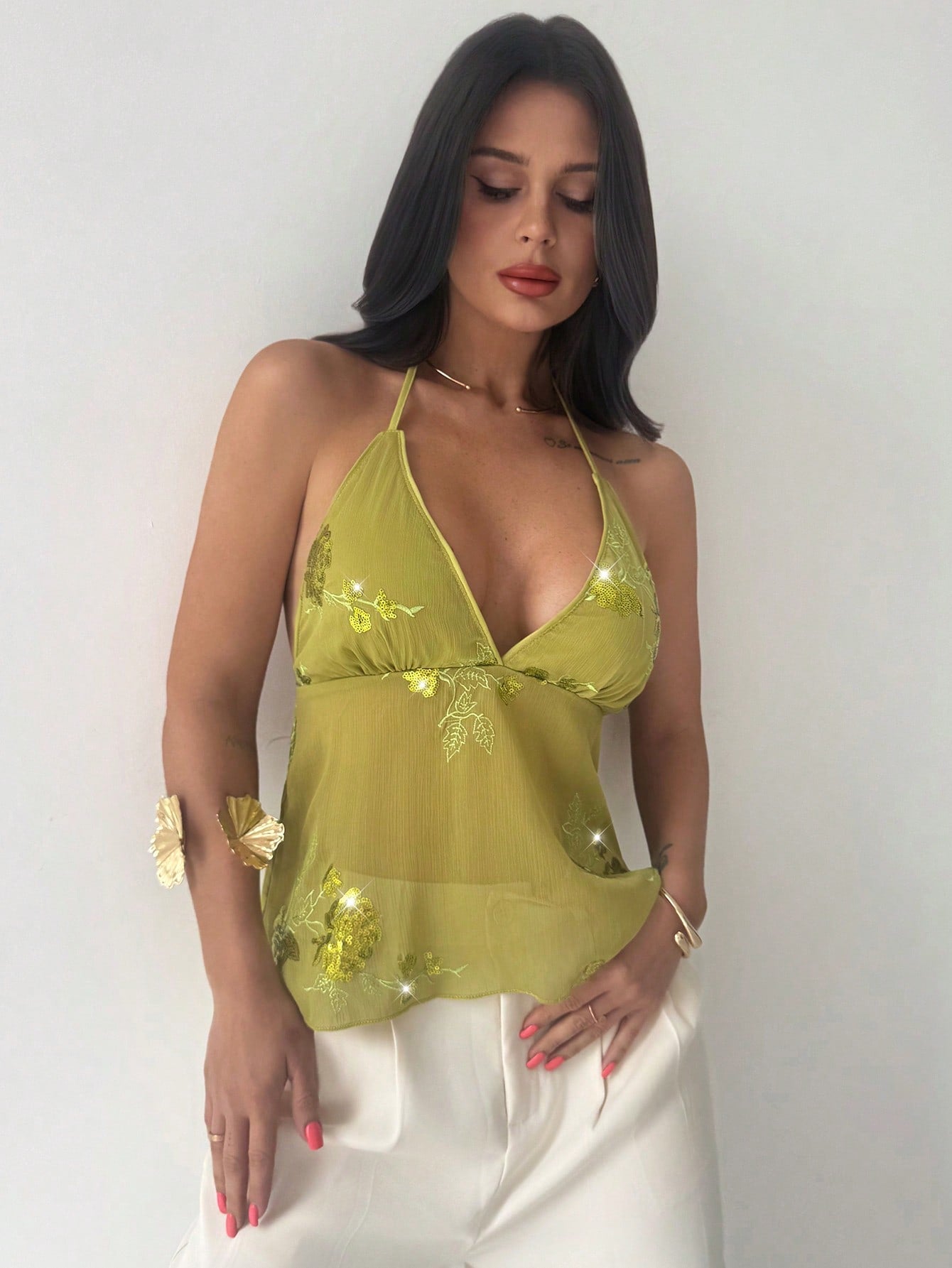Firerie women's green crop cami top with beaded floral embroidery, spaghetti straps, lace-up back, and flared hem