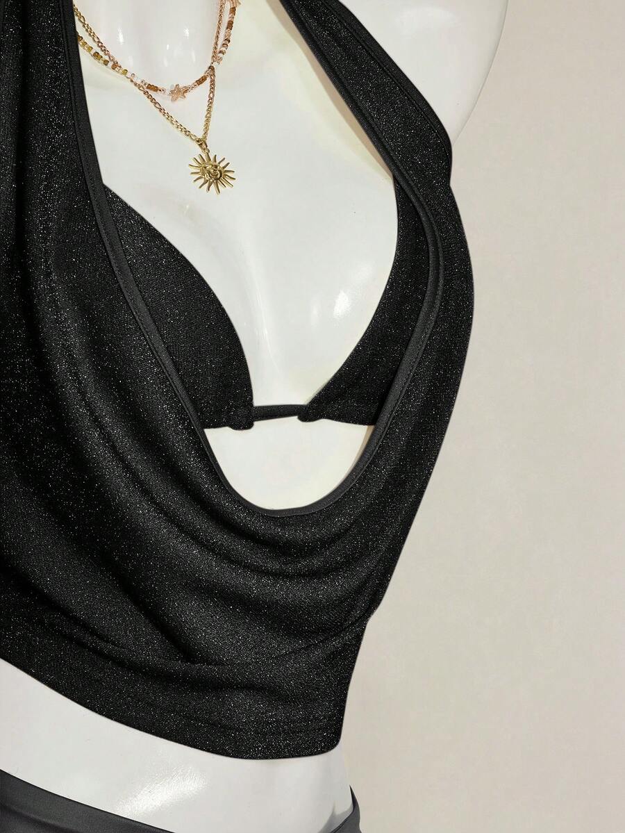 Women's glitter halter backless micro crop tank top featuring a draped knot front design.