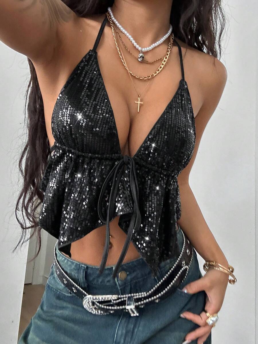 Women's black sequin halter tank top with backless styling, asymmetrical hem, and slim fit design for party, stage, concert, or festival wear.