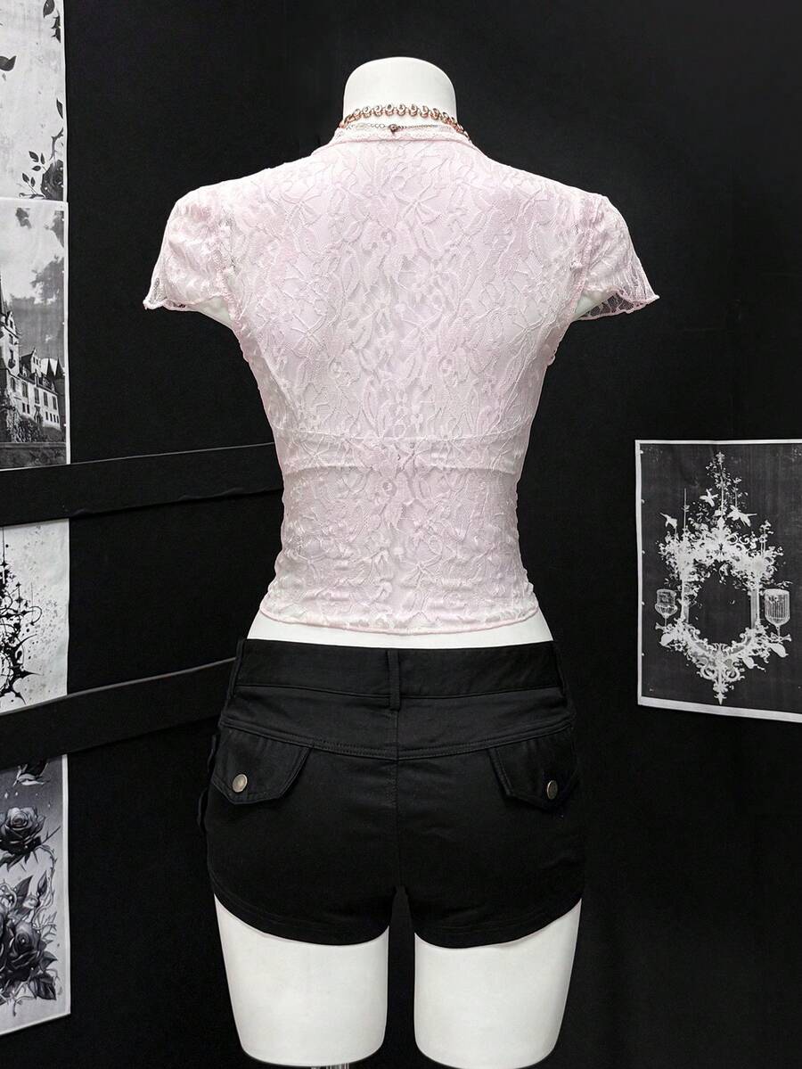 Women's semi-sheer deep V-neck top featuring cap sleeves, contrast lace trimming, and a lace-up front detail.