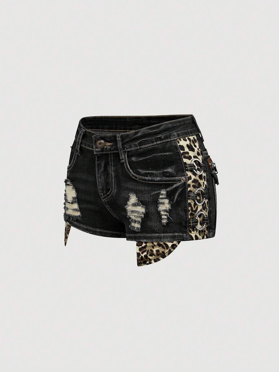 Women's ultra low waist vintage Y2K leopard print skinny mini shorts featuring ripped details, button, and zipper fly.