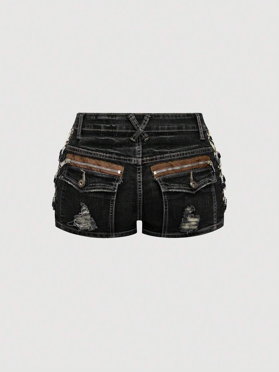 Women's ultra low waist vintage Y2K leopard print skinny mini shorts featuring ripped details, button, and zipper fly.