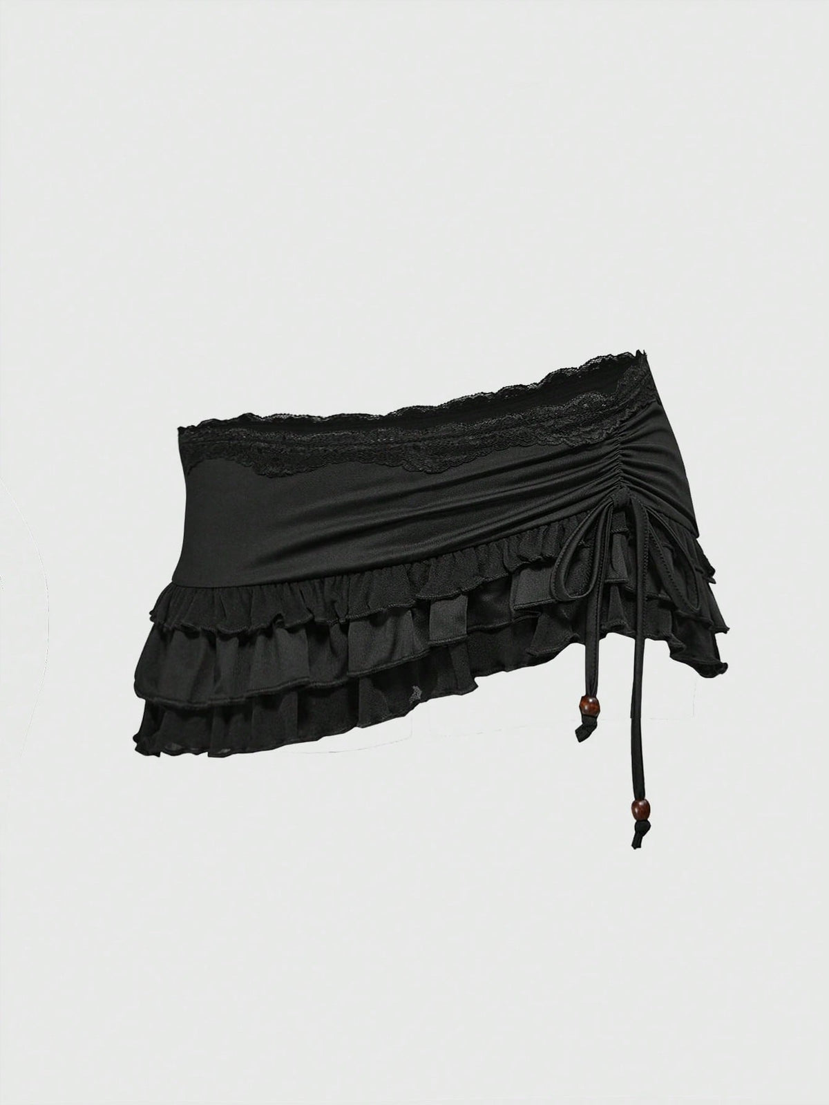Women's black low-waist mini skirt with drawstring tie, ruched details, lace trim, layered ruffle hem, and asymmetric styling