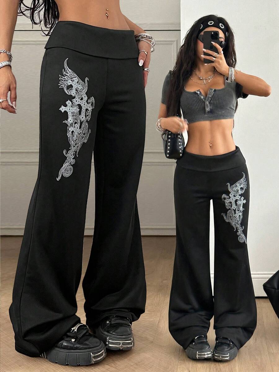 Women's black low waist wide leg flare sweatpants with rib-knit texture and contrast binding details.