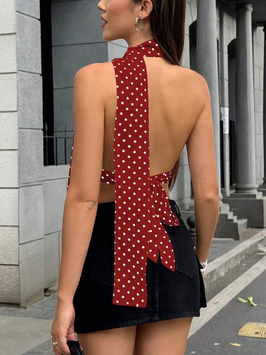 Women's polka dot halter tank top featuring neck straps, a backless tie-back design, regular hem, loose fit, and woven polyester fabric.