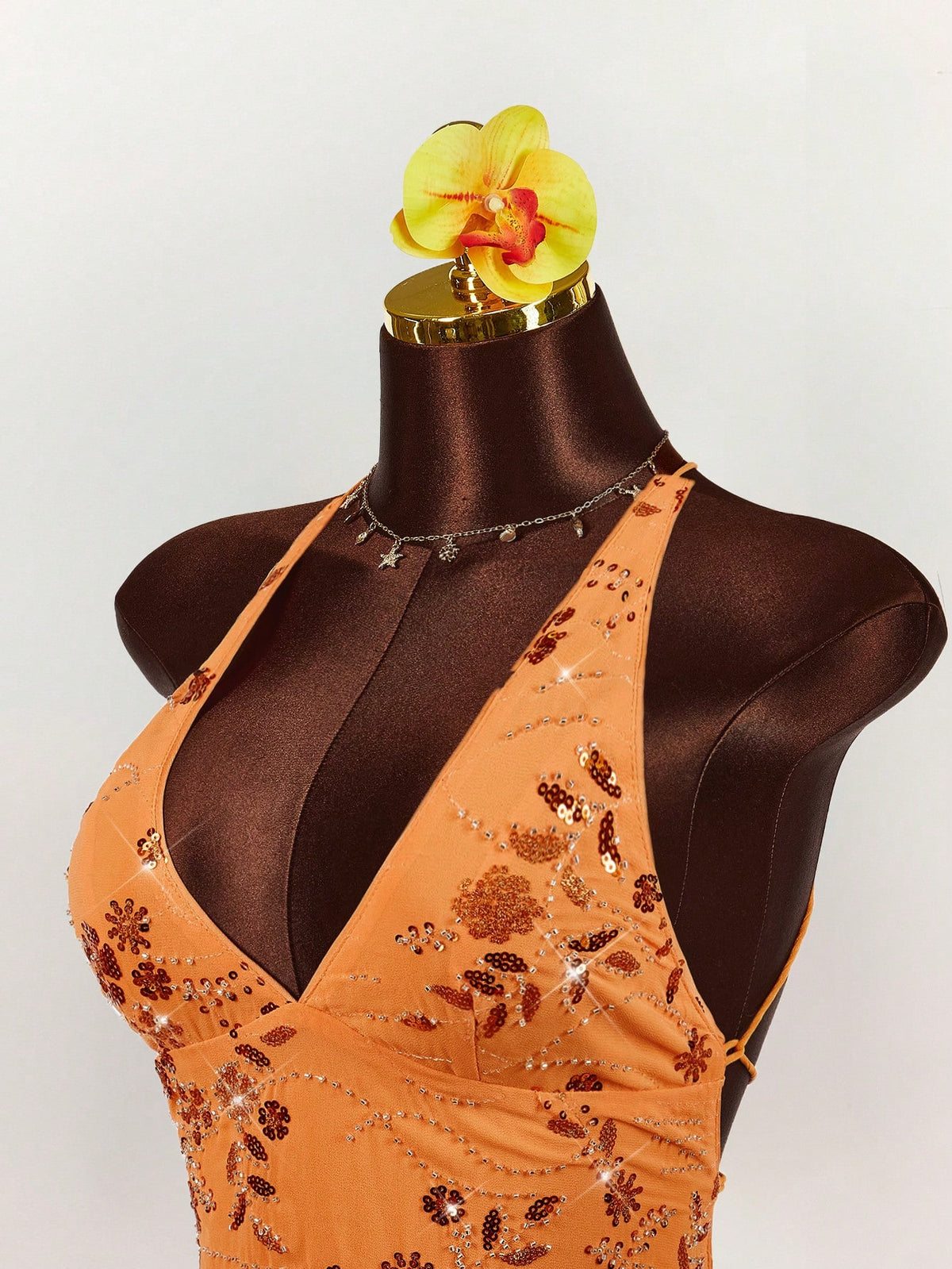 Women's embroidered sequin halter cami top featuring a deep V-neck, backless party design, and slim fit silhouette.
