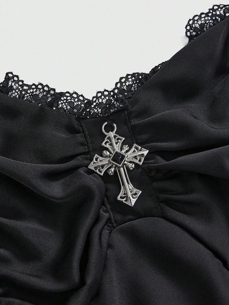 Women's vintage gothic cami dress with high-waist lace-up detail, spaghetti straps, zipper closure, and an asymmetrical knee-length hem.