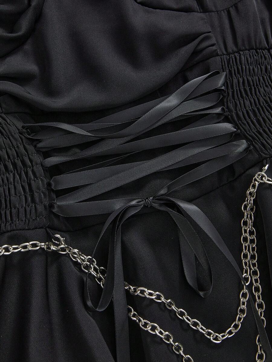 Women's vintage gothic cami dress with high-waist lace-up detail, spaghetti straps, zipper closure, and an asymmetrical knee-length hem.