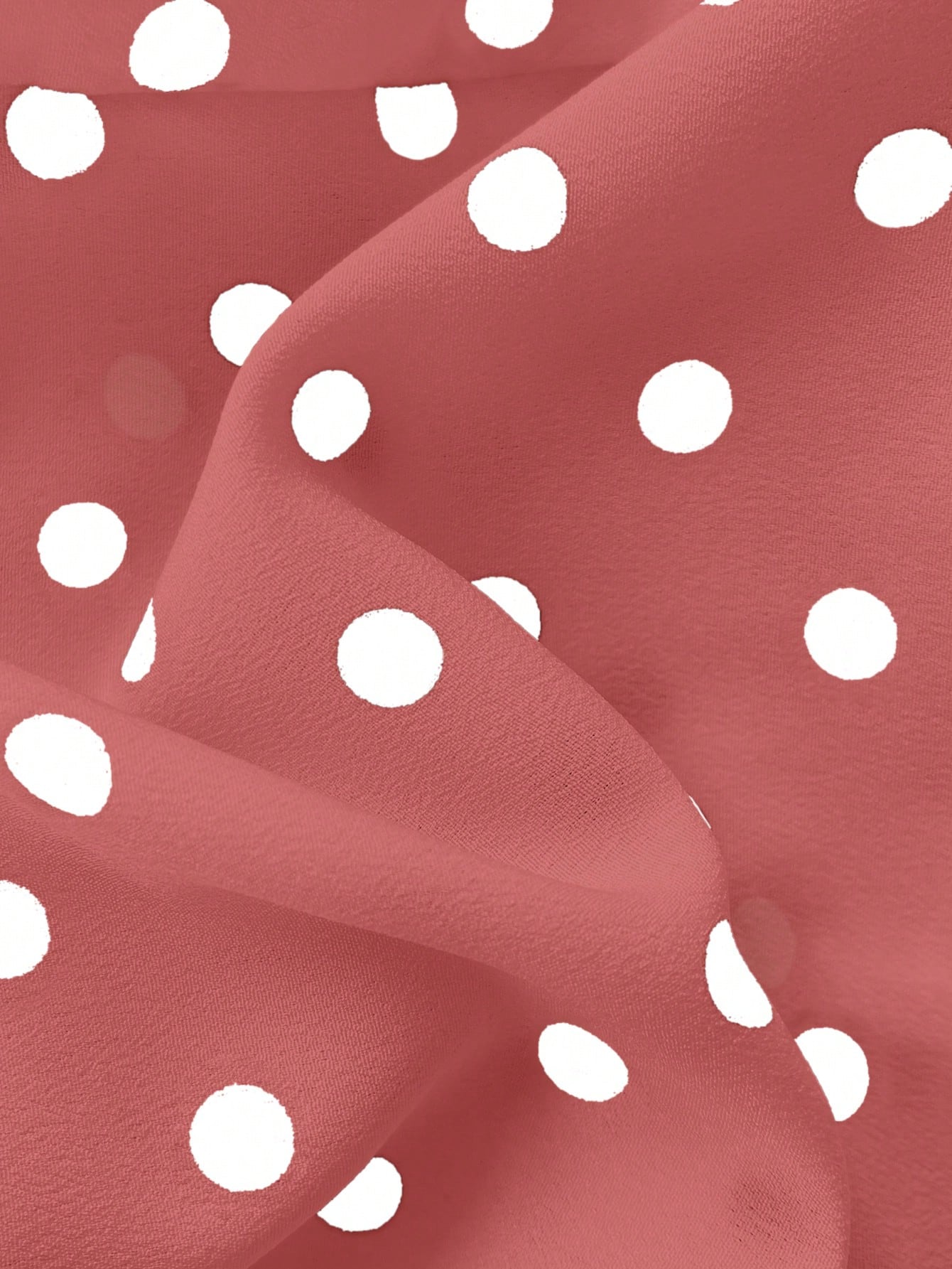 Women's polka dot halter camisole with bow bust detail, ruched and shirred design, slim crop fit, and flared ruffle hem.