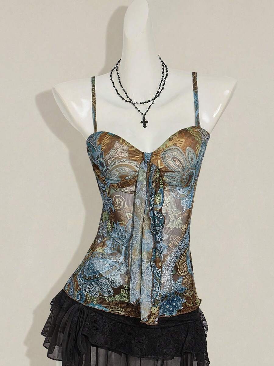 Women's green paisley print Y2K cami top with spaghetti straps, pleated styling, lace-up knot detail, and asymmetrical boho design.