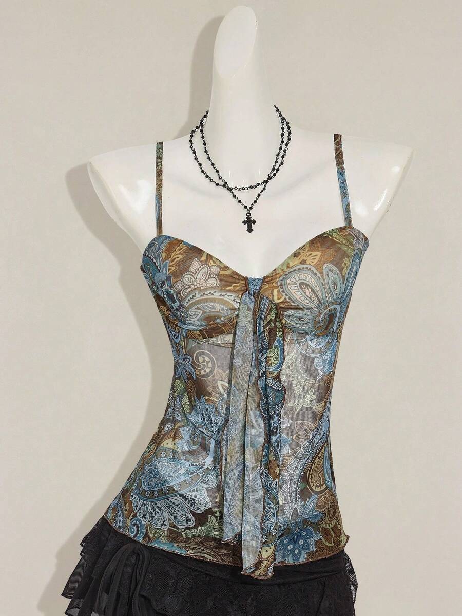 Women's green paisley print Y2K cami top with spaghetti straps, pleated styling, lace-up knot detail, and asymmetrical boho design.
