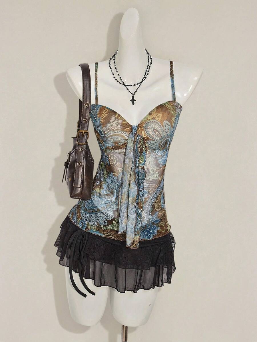Women's green paisley print Y2K cami top with spaghetti straps, pleated styling, lace-up knot detail, and asymmetrical boho design.