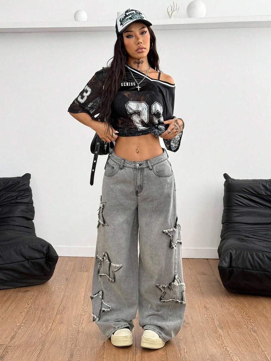 Front view of women's loose wide leg denim jeans featuring a mid waist, classic front pockets, and a zipper fly closure.