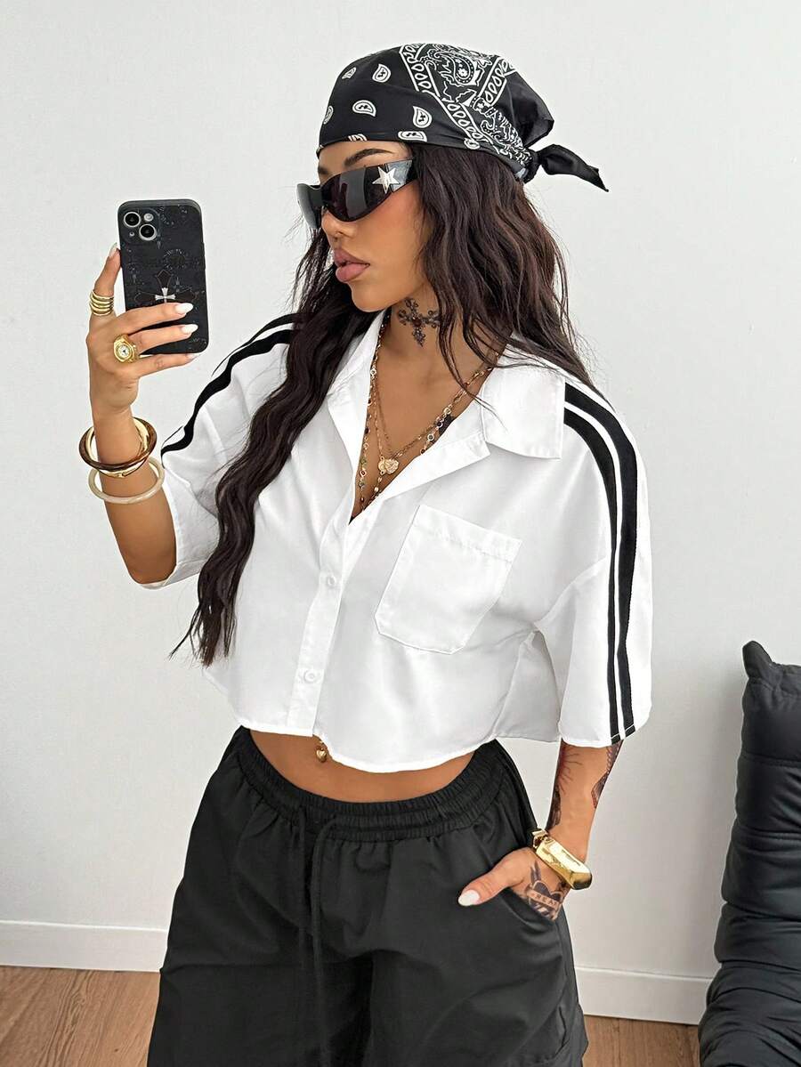 Women's plaid crop shirt with button front, chest pocket, short sleeves, and loose casual fit.