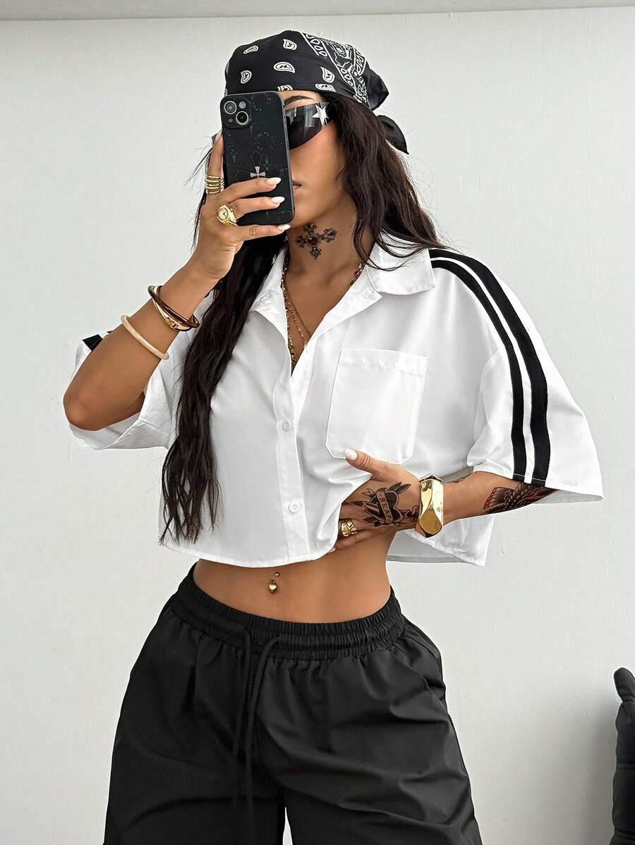 Women's plaid crop shirt with button front, chest pocket, short sleeves, and loose casual fit.