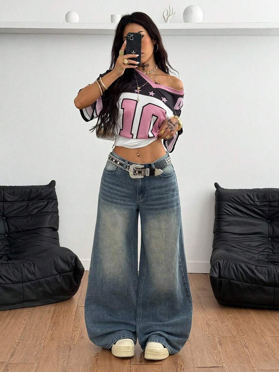 Loose wide leg denim jeans for women featuring a low waist, functional pockets, zipper fly closure, and extra long relaxed fit.