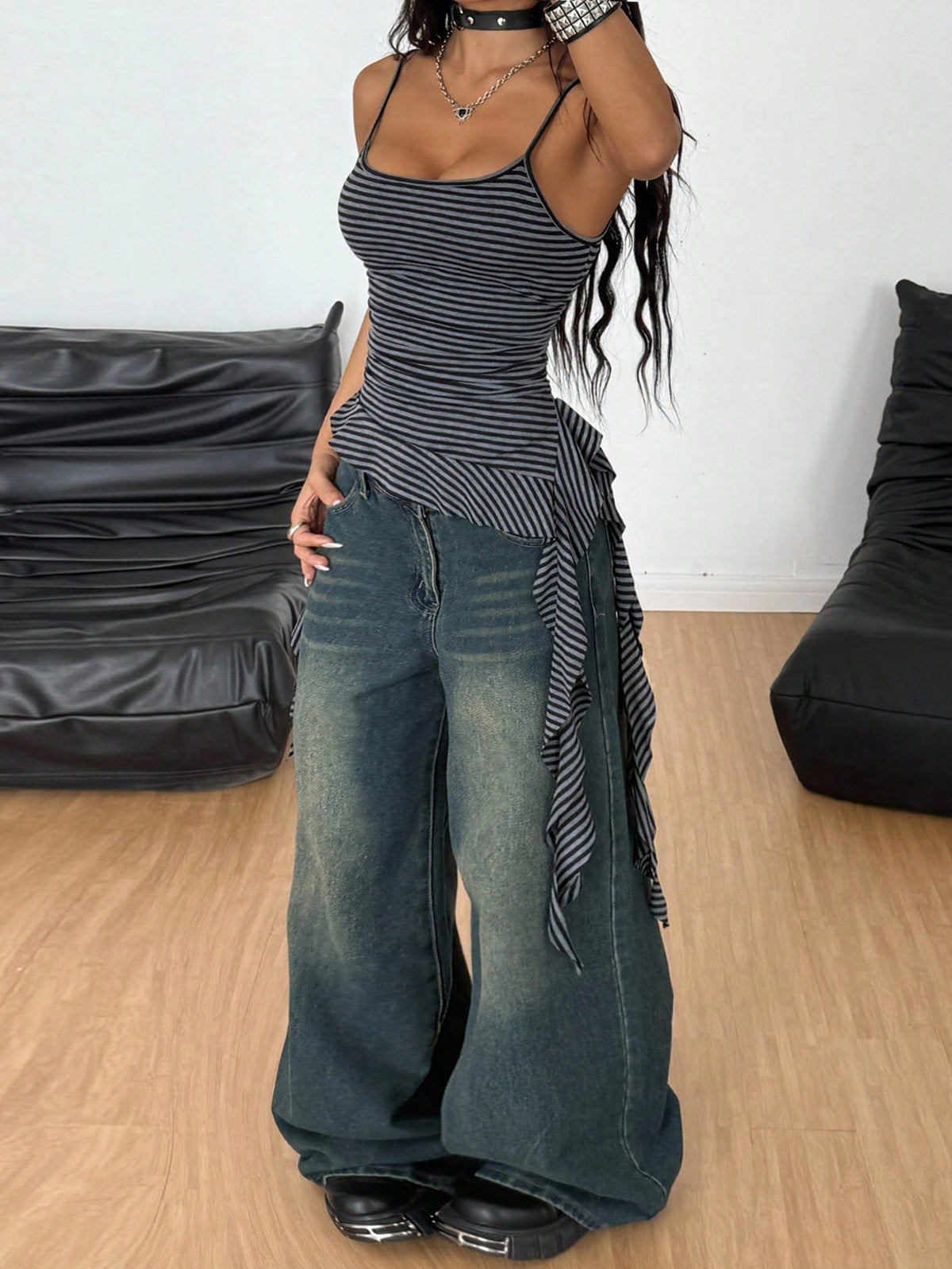 Women's slim fit casual cami top featuring spaghetti straps, ruched detailing, and a ruffle hem.