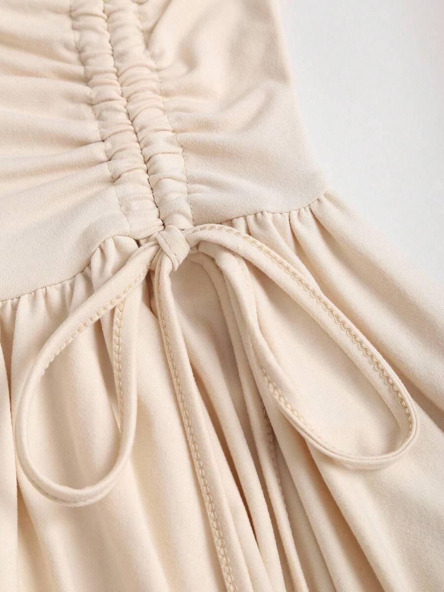 Women's sleeveless halter short dress with a backless design, ruched drawstring detail, slim fit, and asymmetrical hem.