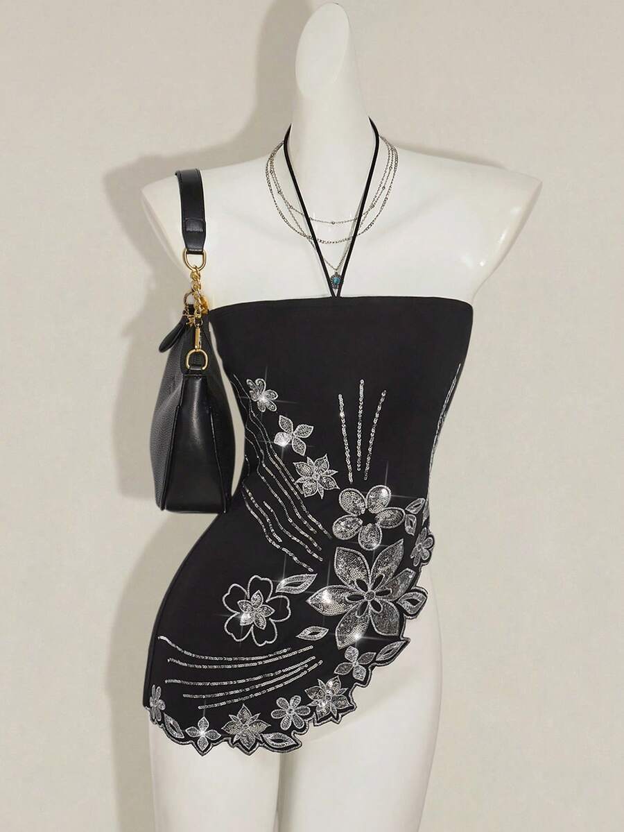 Women's black asymmetrical knitted halter top featuring a slim fit and colorblock pattern
