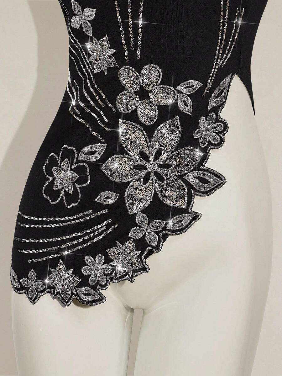 Women's black asymmetrical knitted halter top featuring a slim fit and colorblock pattern
