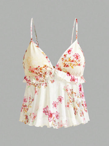 Floral multicolor mesh spaghetti strap cami tank top with backless design, ruffle hem, lettuce trim, and flared long loose fit.