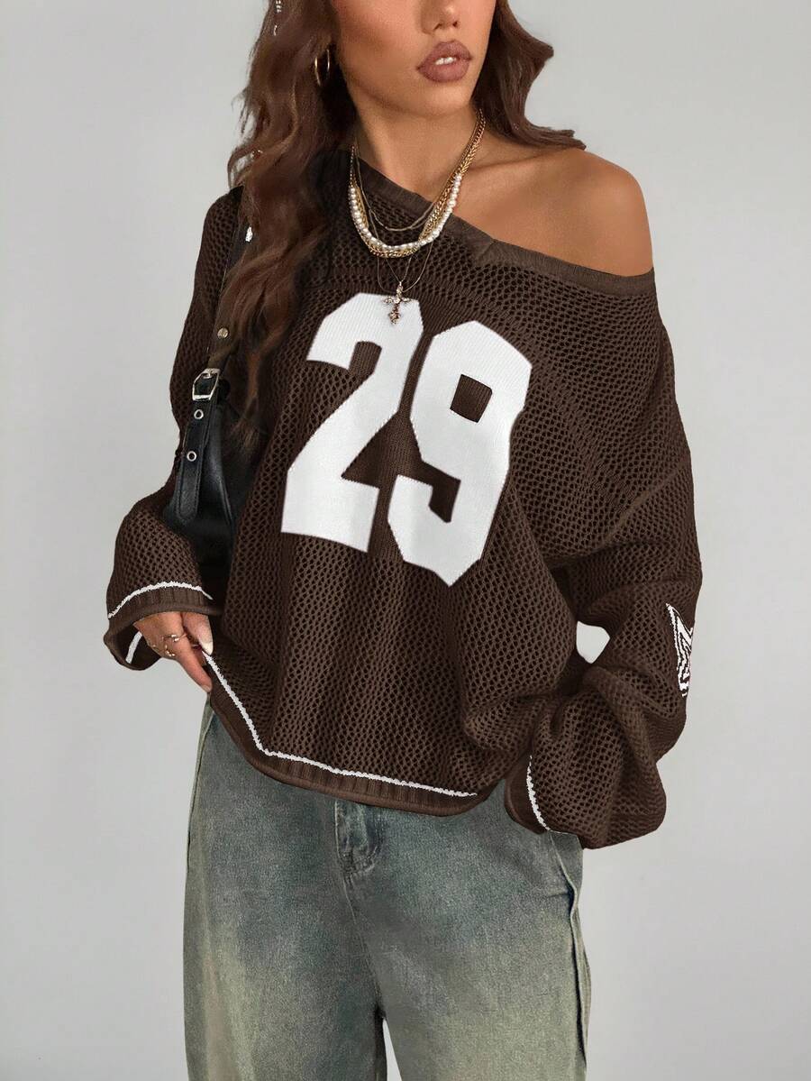 Women's oversized long sleeve knit pullover sweater with round neck, drop shoulder design, and front pocket detail.
