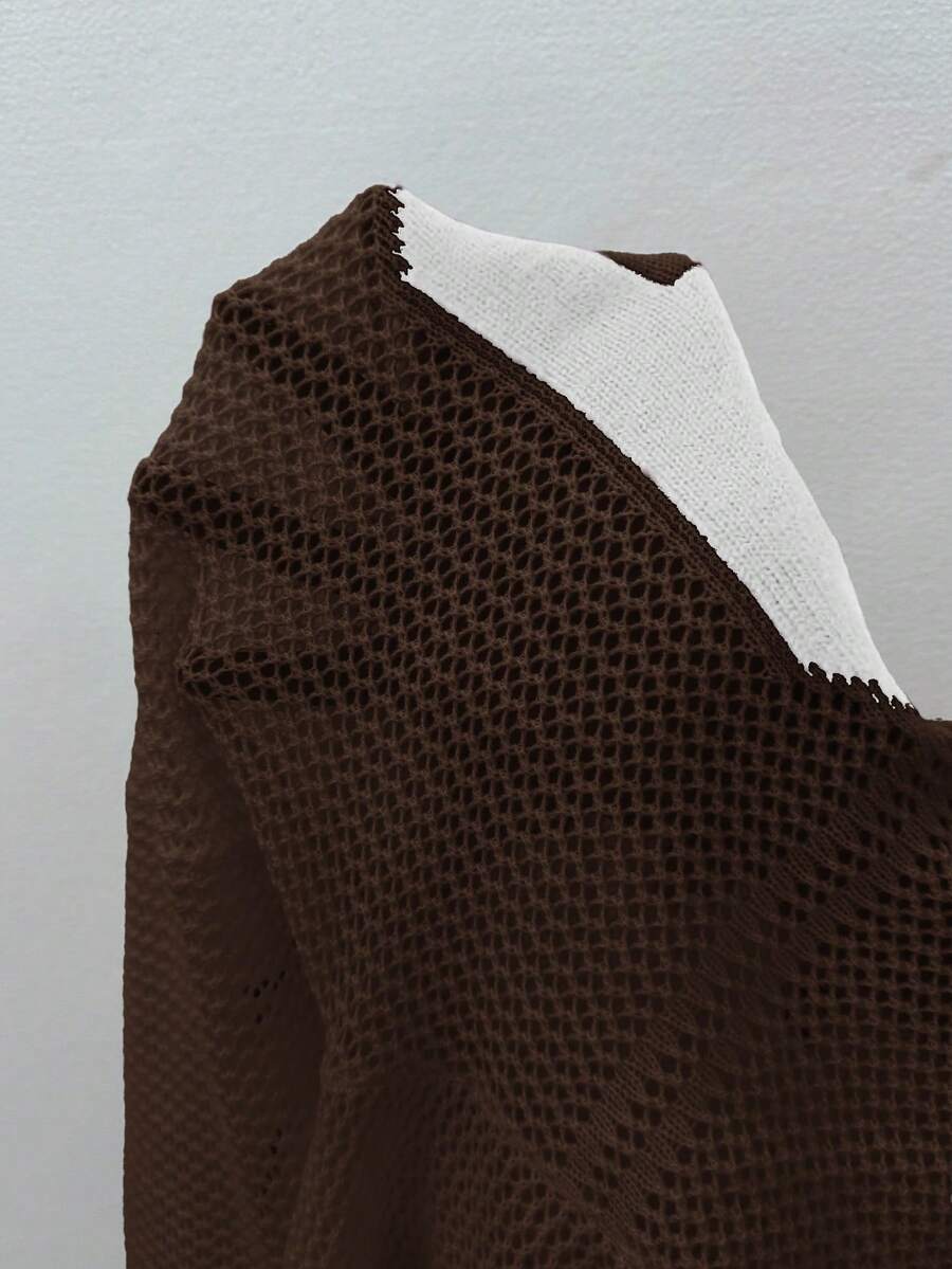 Women's oversized long sleeve knit pullover sweater with round neck, drop shoulder design, and front pocket detail.