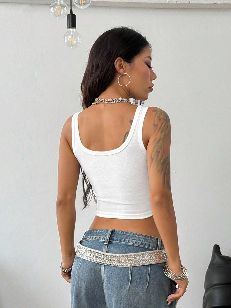 Women's striped rib-knit crop tank top with a notched neckline and slim fit.