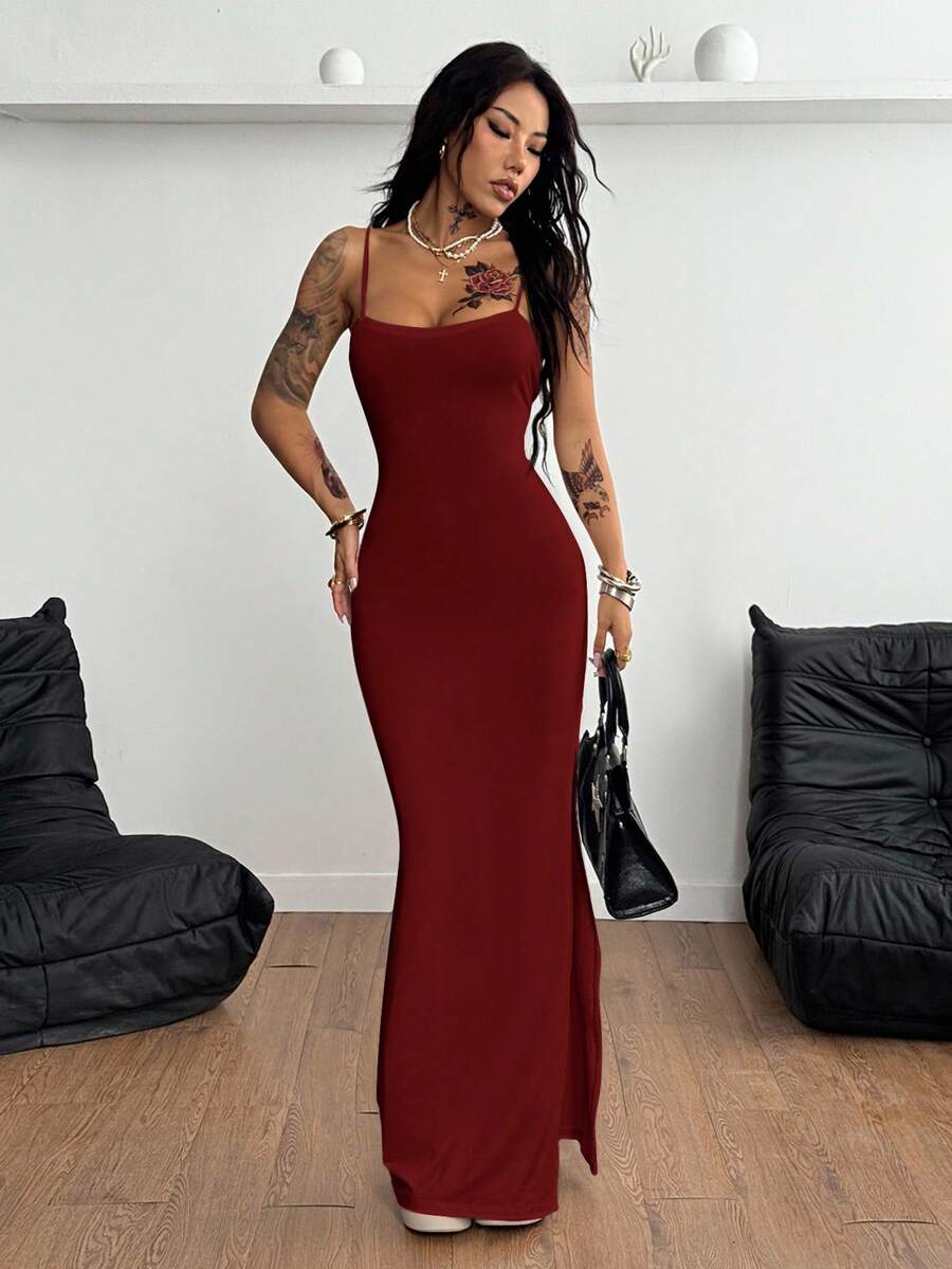 Women's backless cami midi dress in dark grey knit fabric featuring spaghetti straps, lace-up back design, and a split thigh slit.