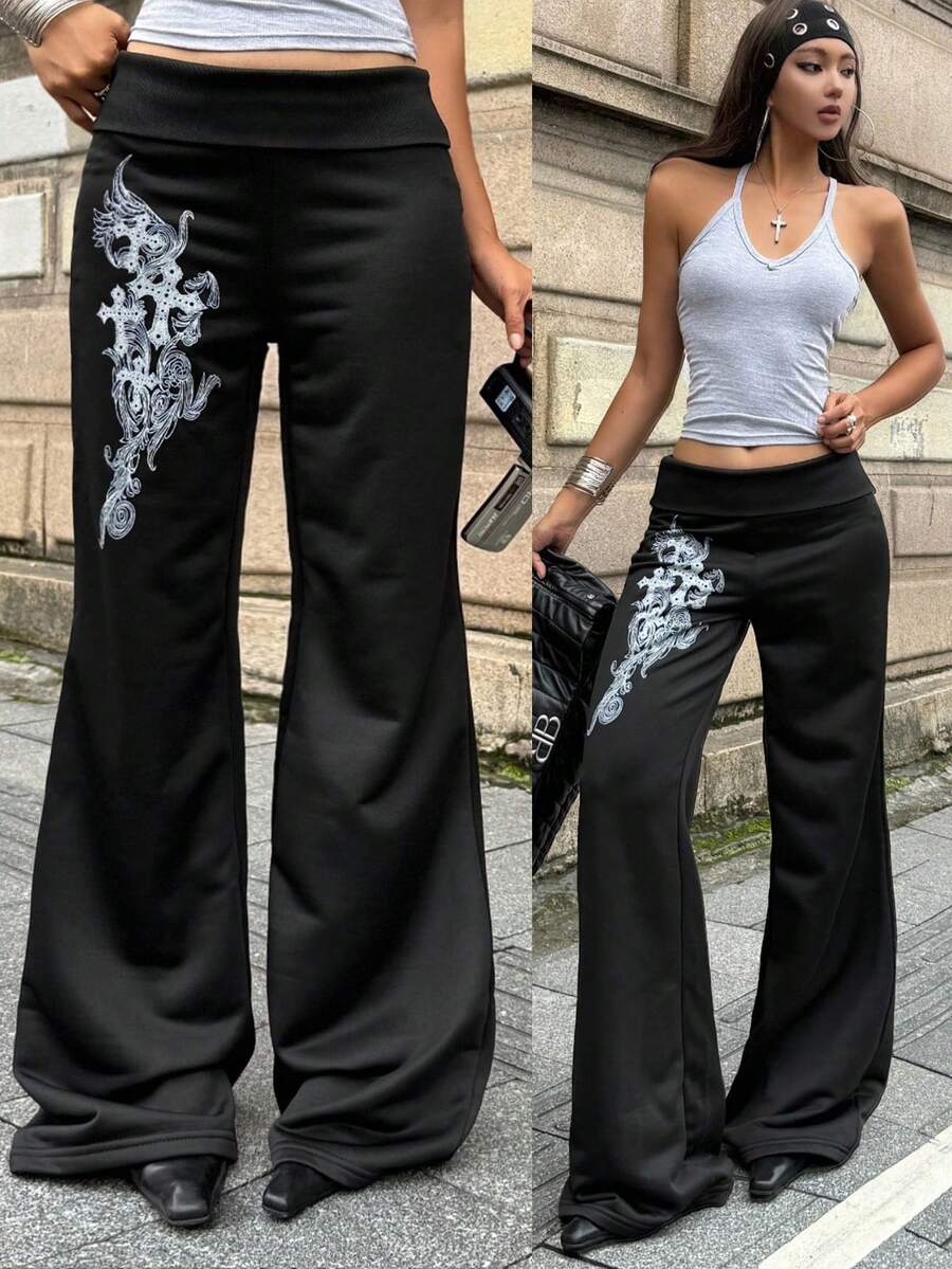 Women's black low waist wide leg flare sweatpants with rib-knit texture and contrast binding details.