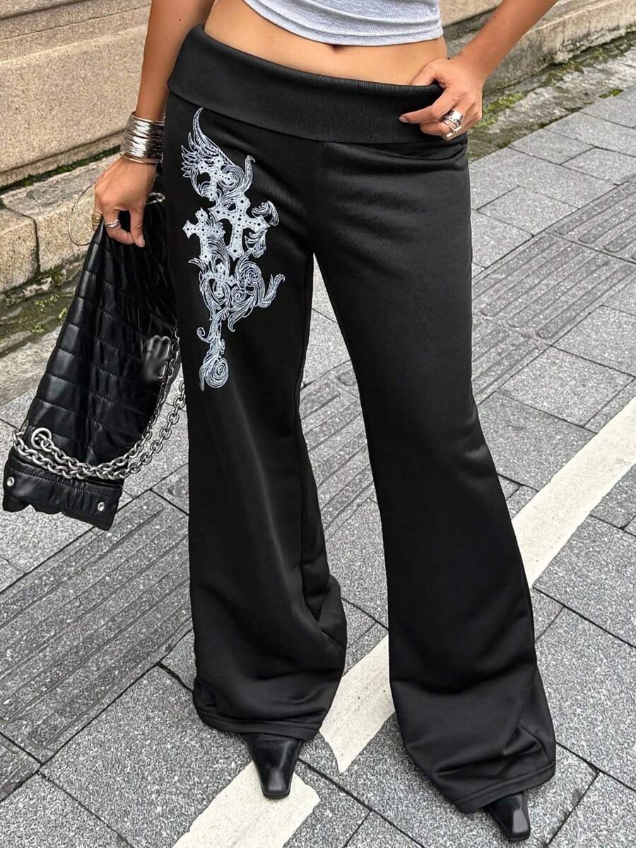 Women's black low waist wide leg flare sweatpants with rib-knit texture and contrast binding details.