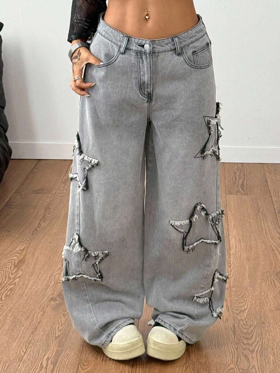 Front view of women's loose wide leg denim jeans featuring a mid waist, classic front pockets, and a zipper fly closure.