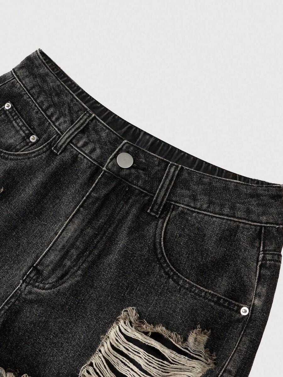 Front view of women's ripped denim shorts featuring raw hem, zipper fly, and pockets
