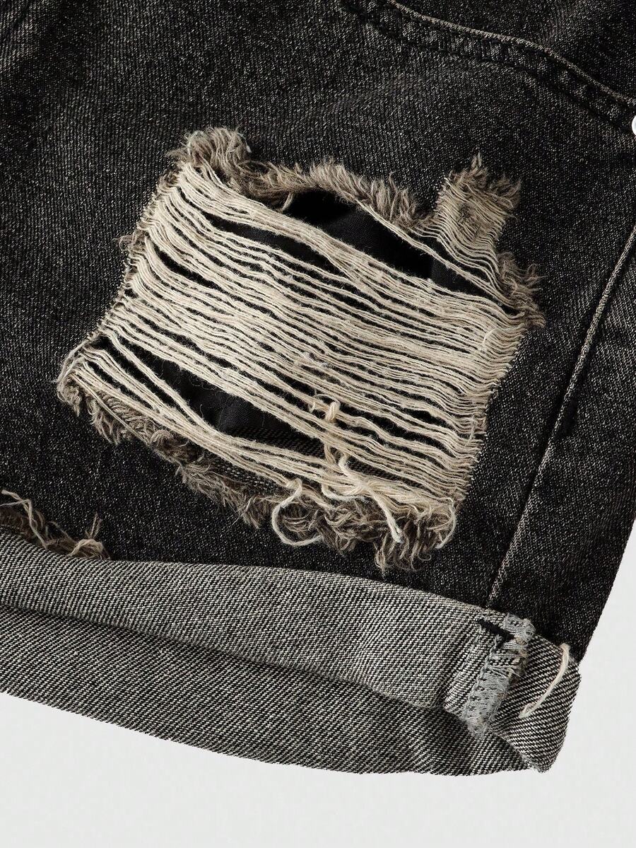 Front view of women's ripped denim shorts featuring raw hem, zipper fly, and pockets