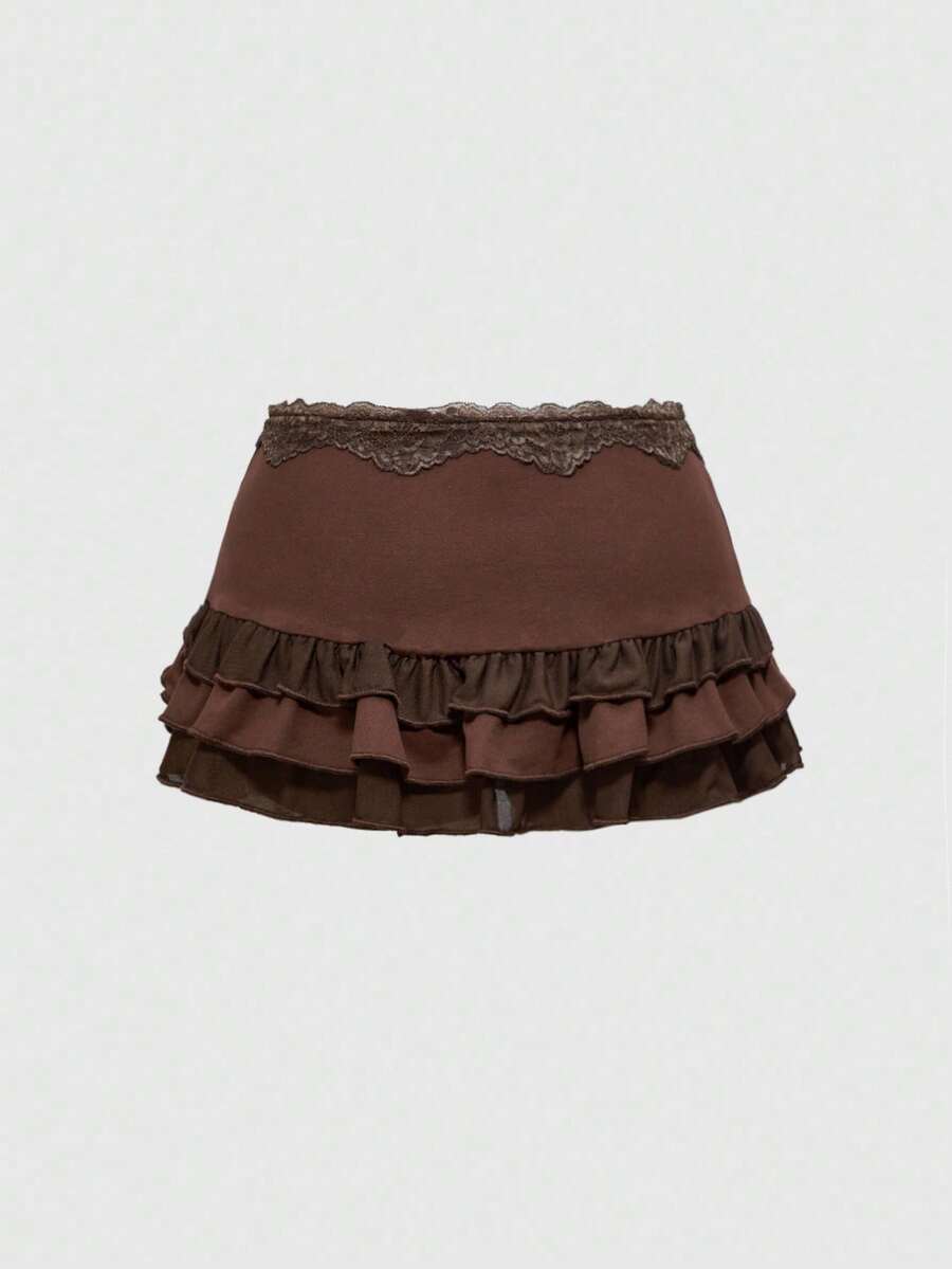 Women's black low-waist mini skirt with drawstring tie, ruched details, lace trim, layered ruffle hem, and asymmetric styling