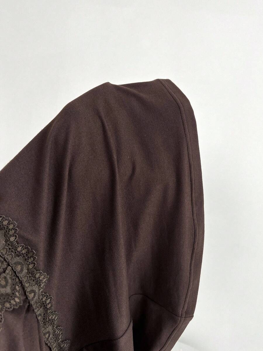 Women's brown slim-fit t-shirt with contrast lace trim, knot detail, scoop neck, and raglan cap sleeves.