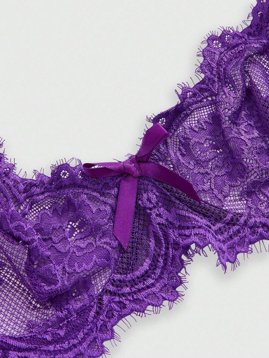 Sheer floral lace underwire triangle bra for women featuring adjustable straps and plunge cup design.