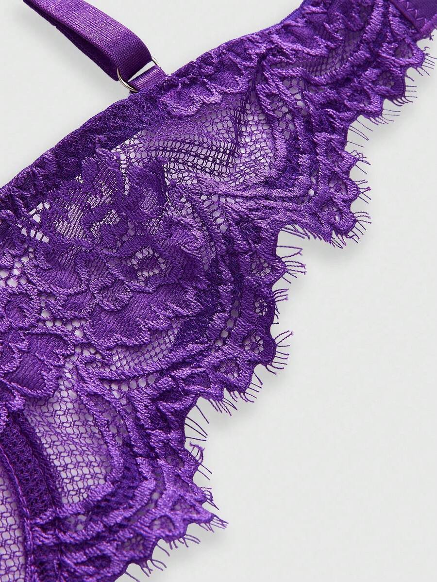 Sheer floral lace underwire triangle bra for women featuring adjustable straps and plunge cup design.