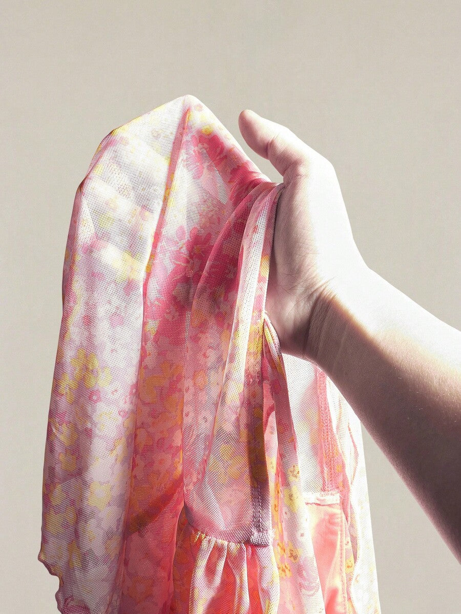 Women's white cherry print cami top with wide straps, ruched knot detail, and an asymmetrical hem