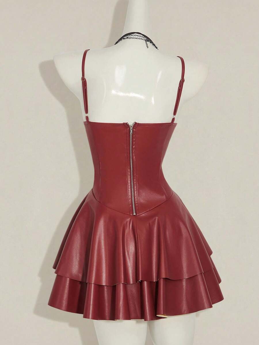 Women's Y2K PU leather mini dress with spaghetti straps, V-neckline, backless design, zipper closure, high waist, slim A-line fit, and layered tiered hem.