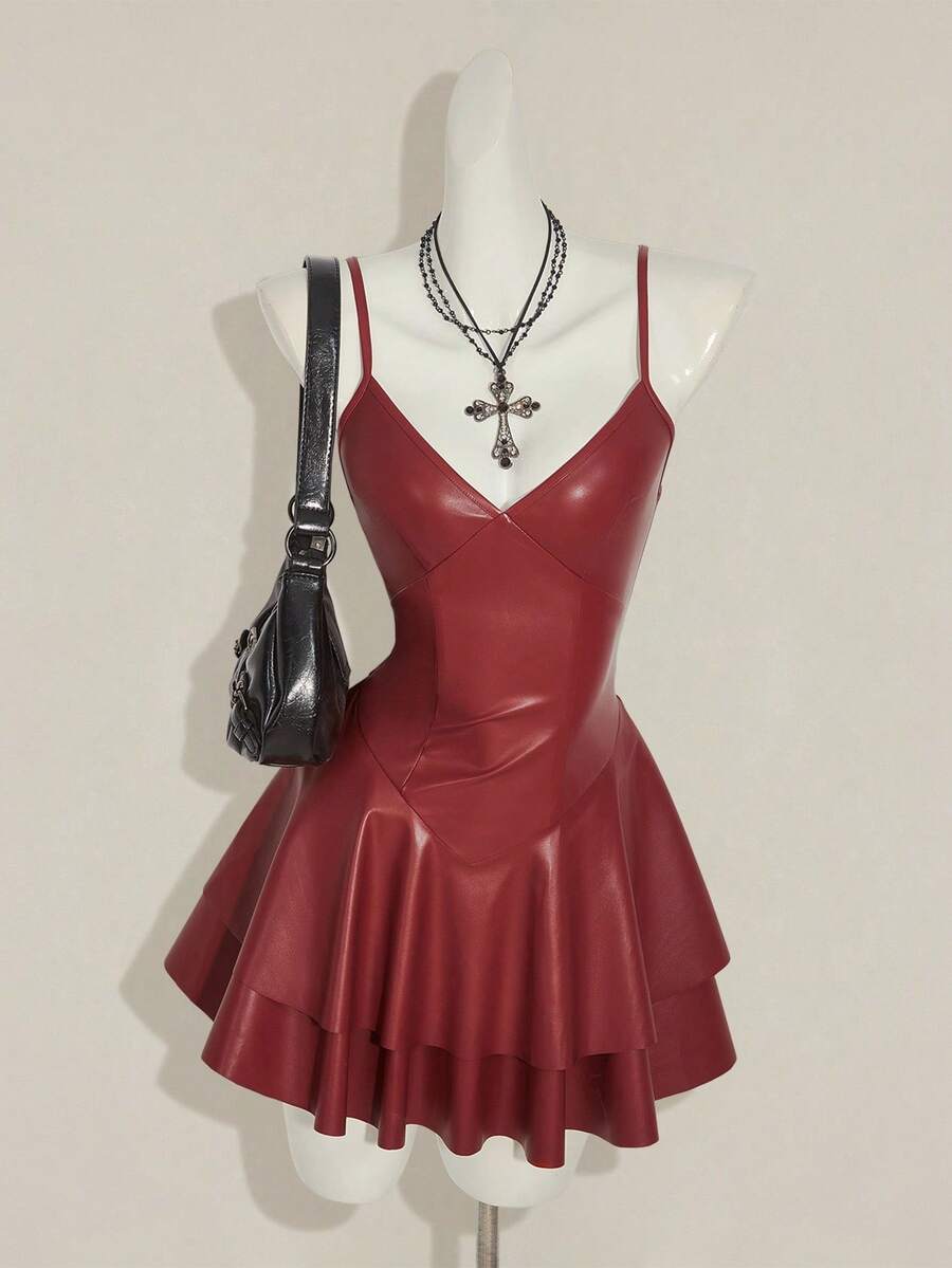 Women's Y2K PU leather mini dress with spaghetti straps, V-neckline, backless design, zipper closure, high waist, slim A-line fit, and layered tiered hem.