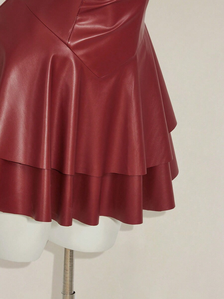 Women's Y2K PU leather mini dress with spaghetti straps, V-neckline, backless design, zipper closure, high waist, slim A-line fit, and layered tiered hem.