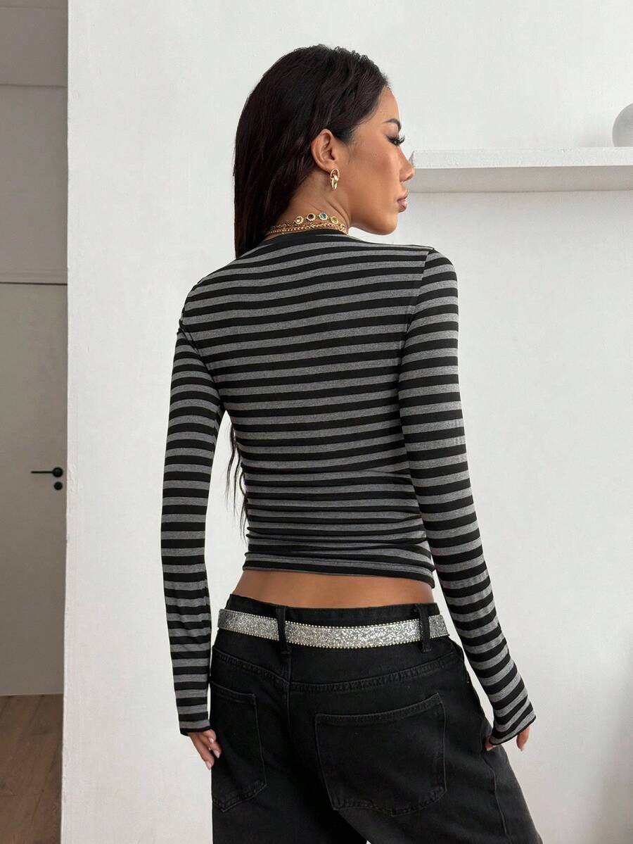 Women's slim fit long sleeve t-shirt with a deep V-neck cut from stretchy knit fabric.