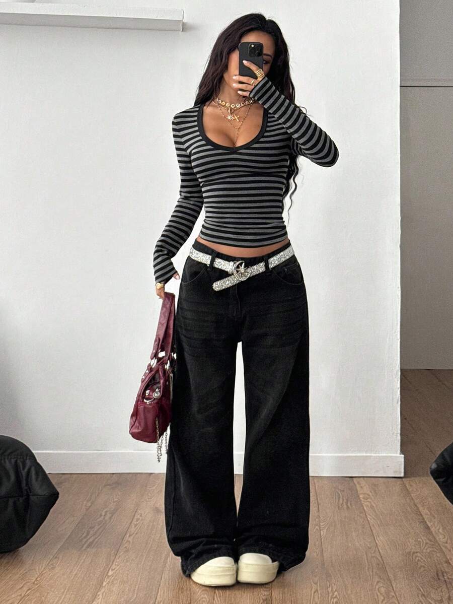 Women's slim fit long sleeve t-shirt with a deep V-neck cut from stretchy knit fabric.