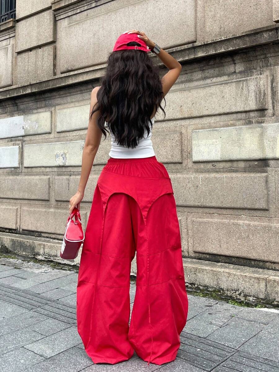 Women's casual wide leg long pants featuring an elastic drawstring waistband and loose fit silhouette.