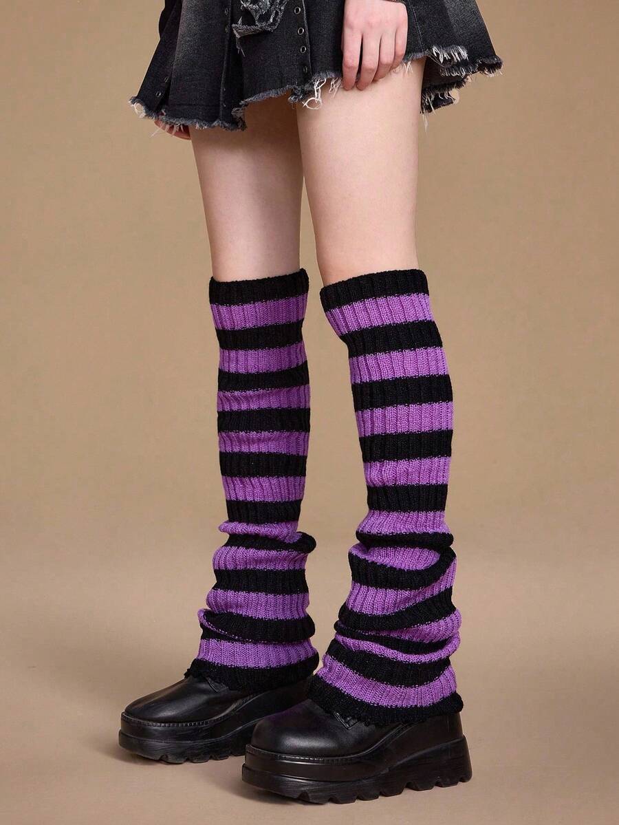 Pair of women's extra long knitted leg warmers featuring a gothic grunge design with subtle ruffle detailing.