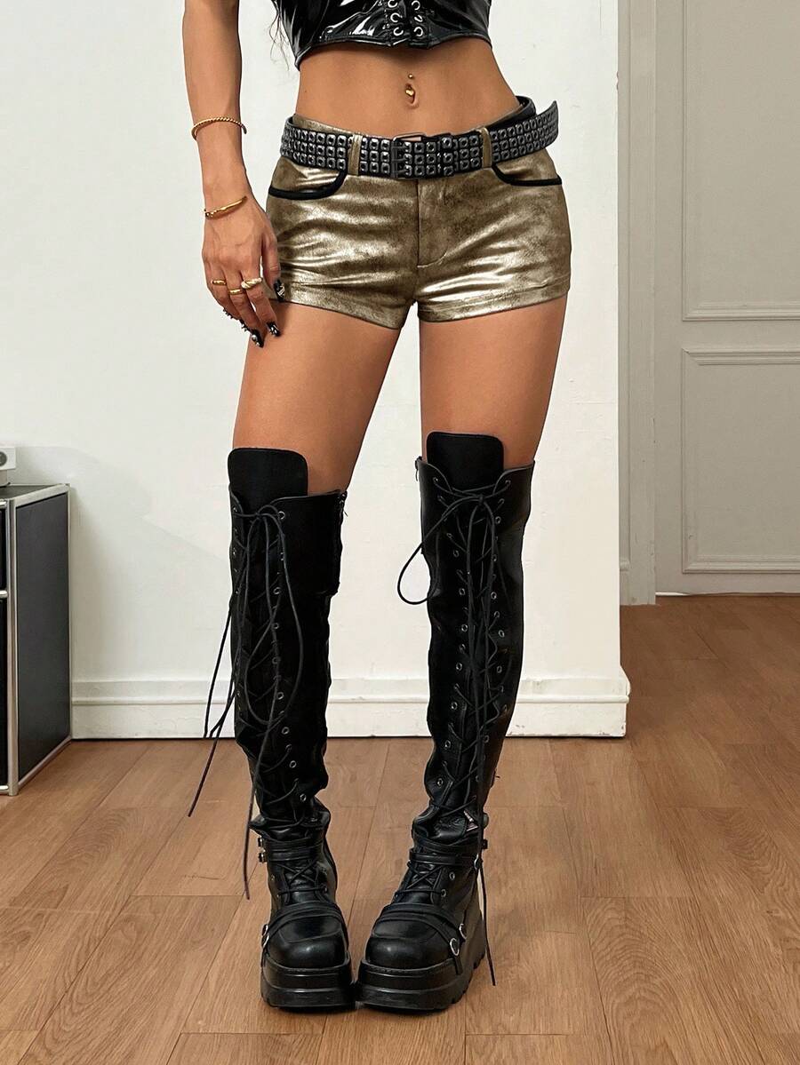 Women's metallic sequin ultra low waist mini shorts with zipper fly, grommet eyelet accents, straight leg cut, and skinny fit for party, concert, festival, and night out styling.