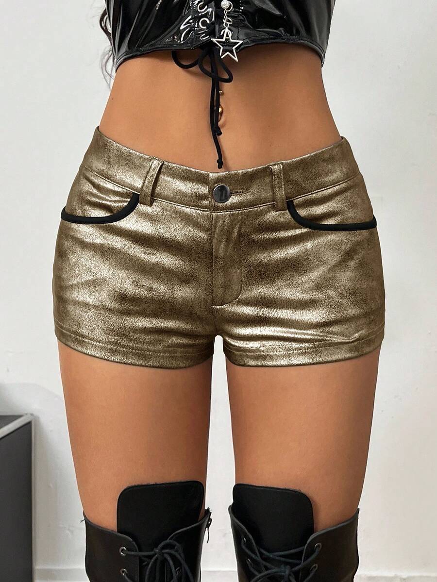 Women's metallic sequin ultra low waist mini shorts with zipper fly, grommet eyelet accents, straight leg cut, and skinny fit for party, concert, festival, and night out styling.