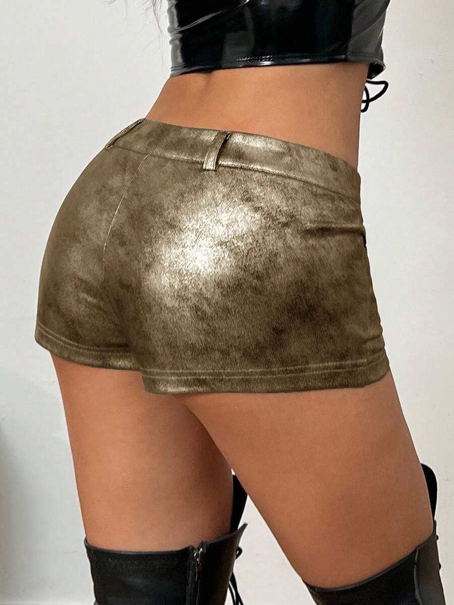 Women's metallic sequin ultra low waist mini shorts with zipper fly, grommet eyelet accents, straight leg cut, and skinny fit for party, concert, festival, and night out styling.